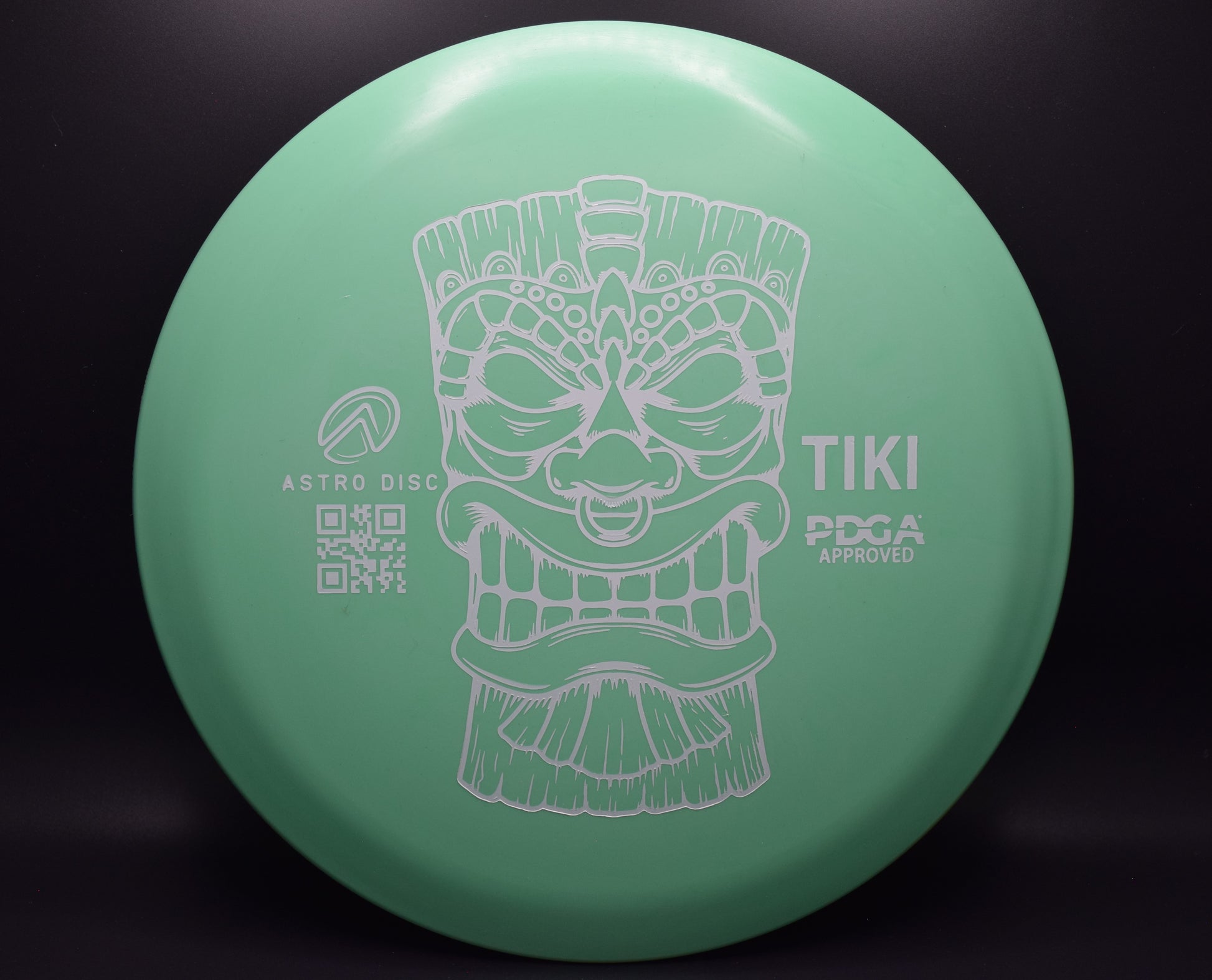 Tiki - green with a white stamp.